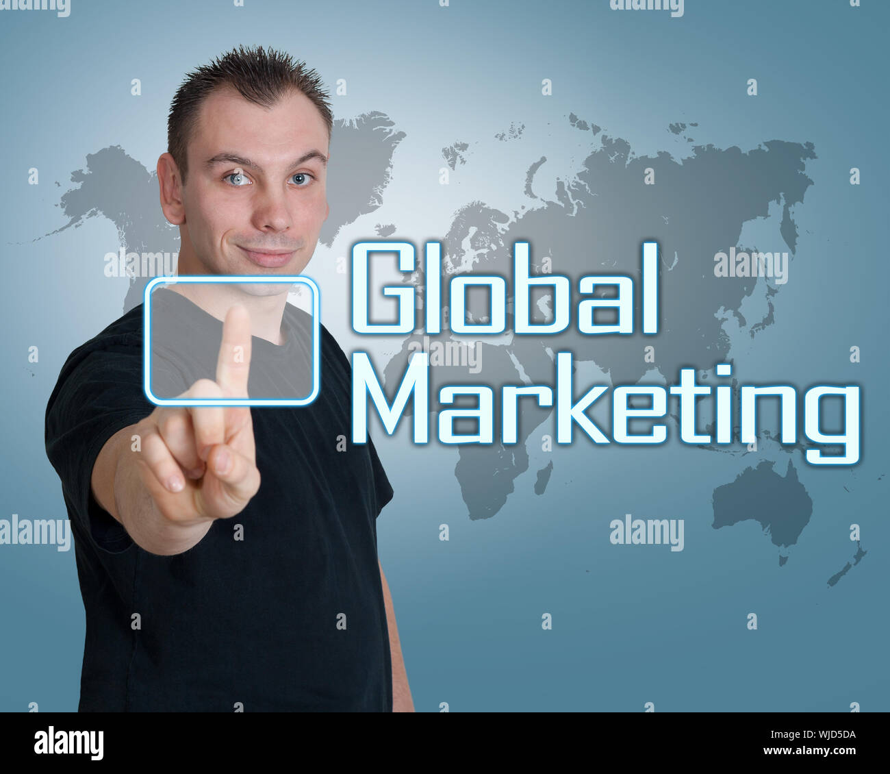 Young man press digital Global Marketing  button on interface in front of him Stock Photo