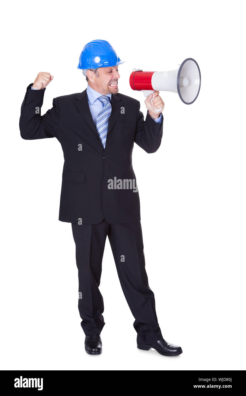 Male Architect Shouting In Megaphone On White Background Stock Photo