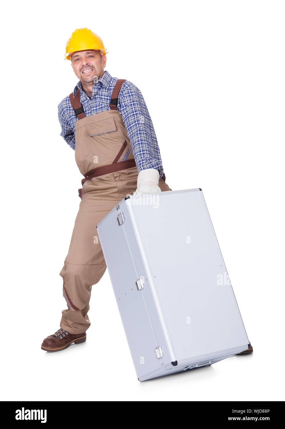 Man With Back Pain Lifting Metal Box Isolated On White Background Stock Photo