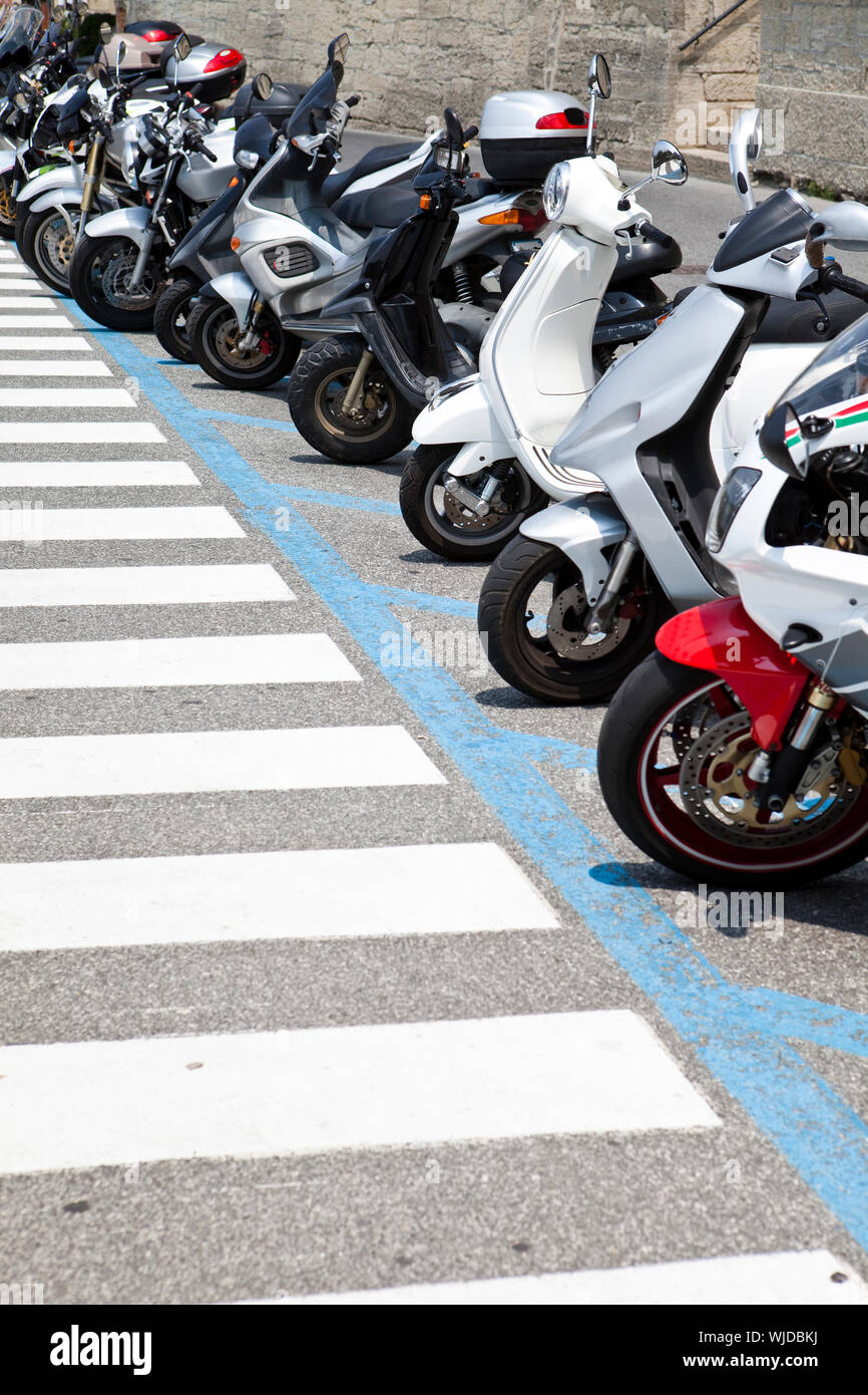 Row of parked motorcycles Stock Photo