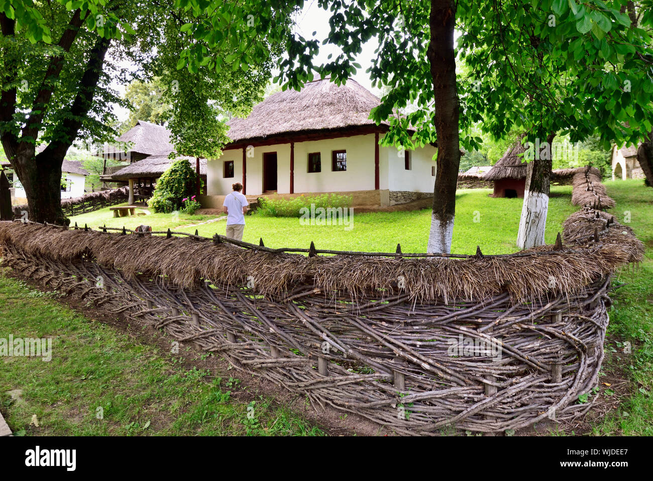 The National Village Museum, an open-air ethnographic museum showcasing 272 authentic peasant farms and houses from Romania. Bucharest Stock Photo
