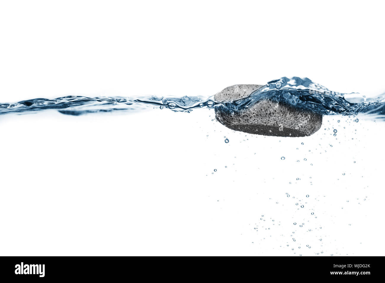 Pumice stone floating in crisp clear water Stock Photo Alamy