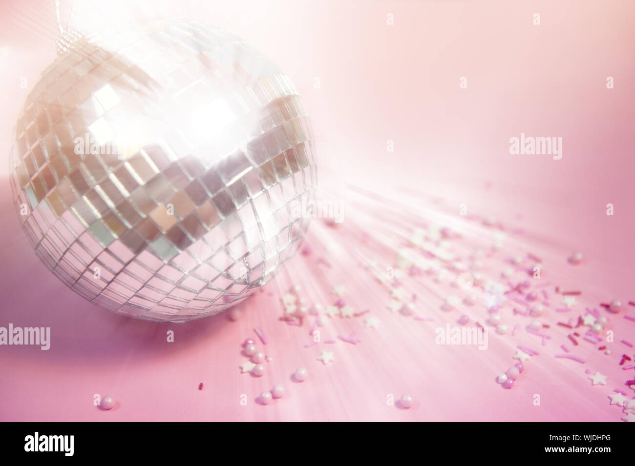 A Colorful Disco Ball In 3d Rotating With Particles And Rays Background,  Reflection, Spot Light, Light Reflection Background Image And Wallpaper for  Free Download