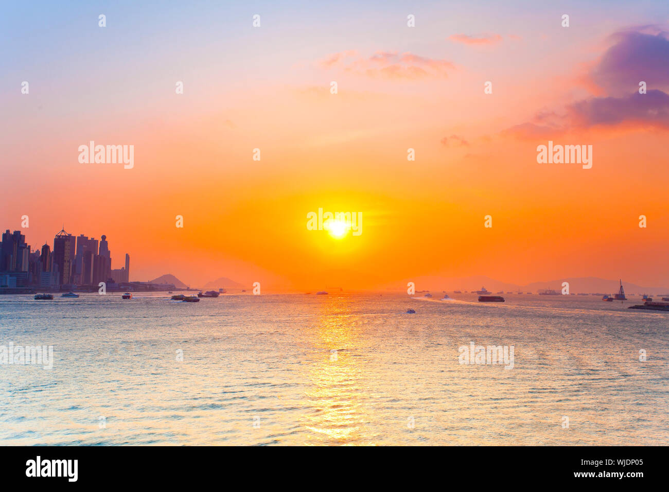 Sunset sea in Hong Kong Stock Photo - Alamy