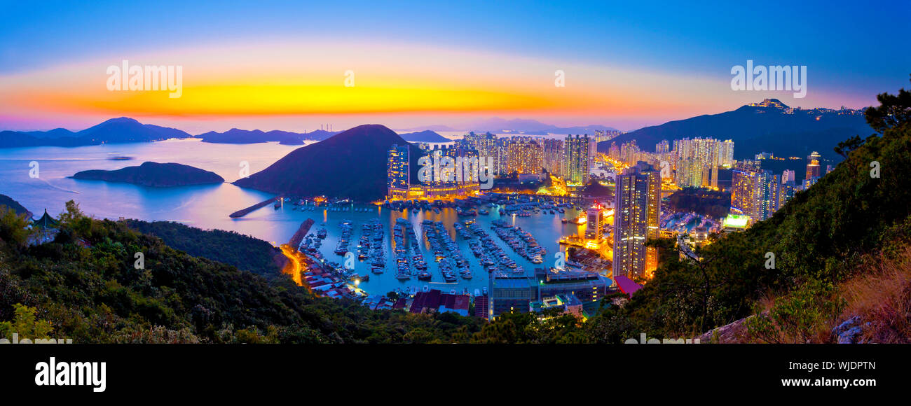Sunset at typhoon shelter in mountain in Hong Kong Stock Photo