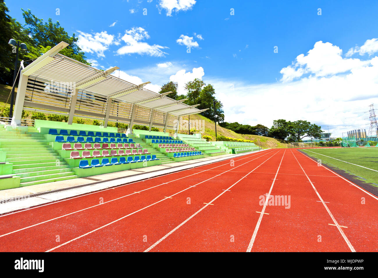 Running track in sports ground Stock Photo Alamy