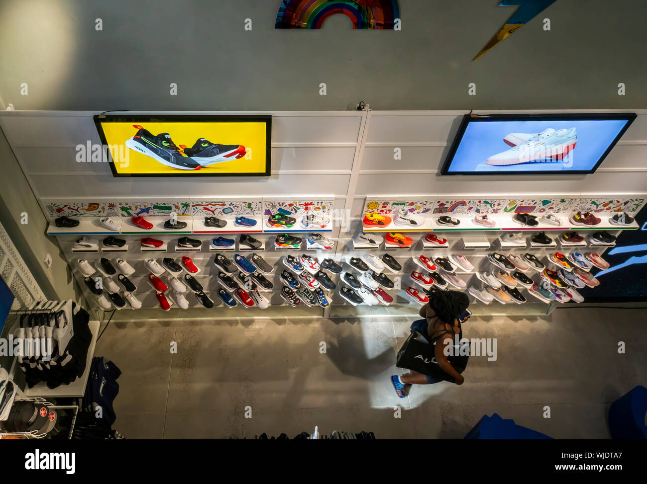 Shoppers and visitors flock to the newly opened Puma flagship store on Fifth Avenue in New York on Thursday, August 29, 2019. The 18,000 square foot, two level store is Puma’s first location in New York. Puma is rated the eleventh largest athletic footwear company in the U.S., all of which are attempting to take market share from number one, Nike. (© Richard B. Levine) Stock Photo