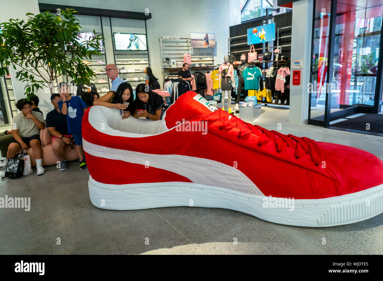 Shoppers and visitors flock to the newly opened Puma flagship store on  Fifth Avenue in New York on Thursday, August 29, 2019. The 18,000 square  foot, two level store is Puma's first