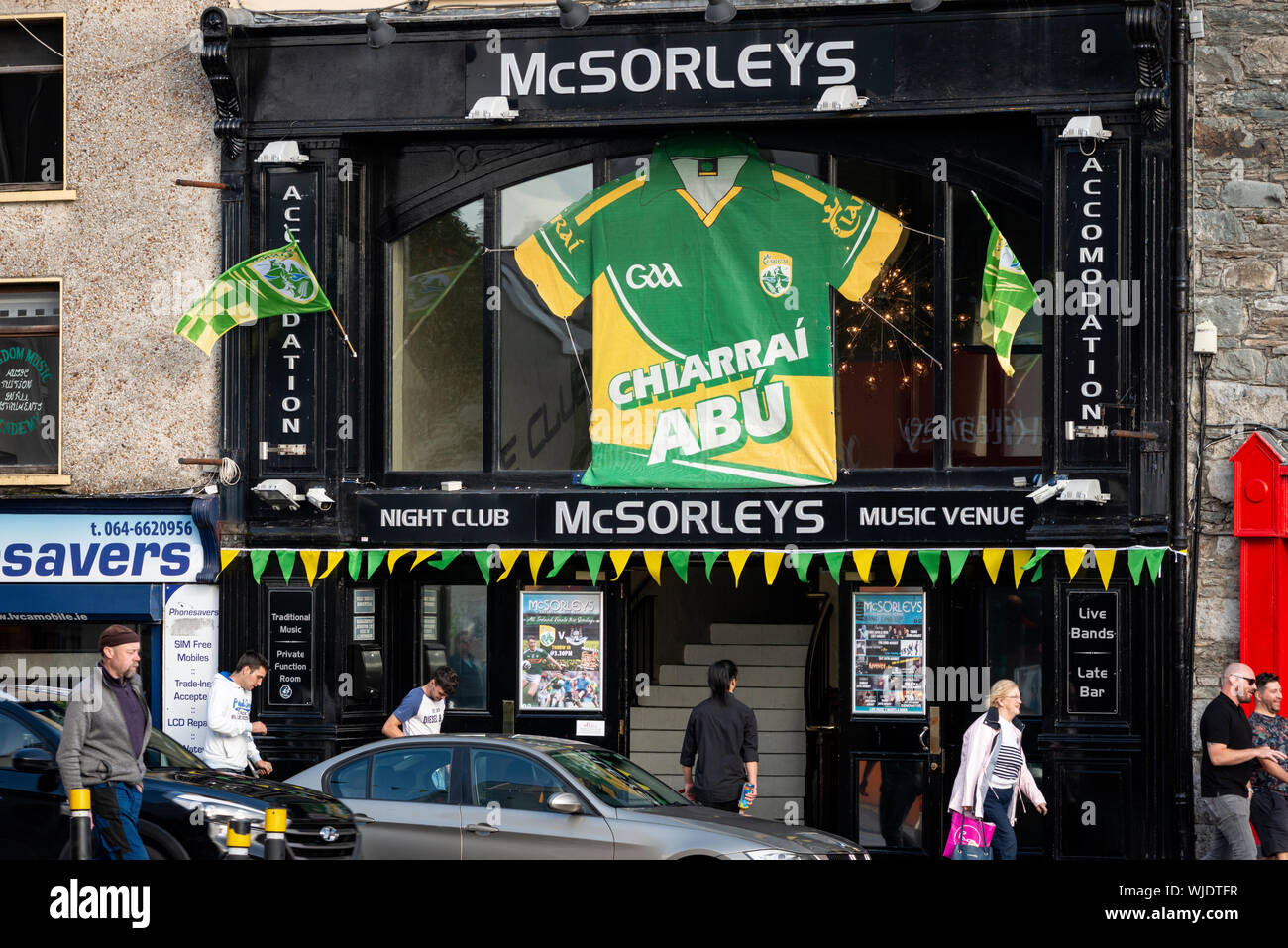 Large green and yellow GAA football Kerry jersey on the facade of the McSorleys bar in Killarney, County Kerry, Ireland as of 2019 Stock Photo