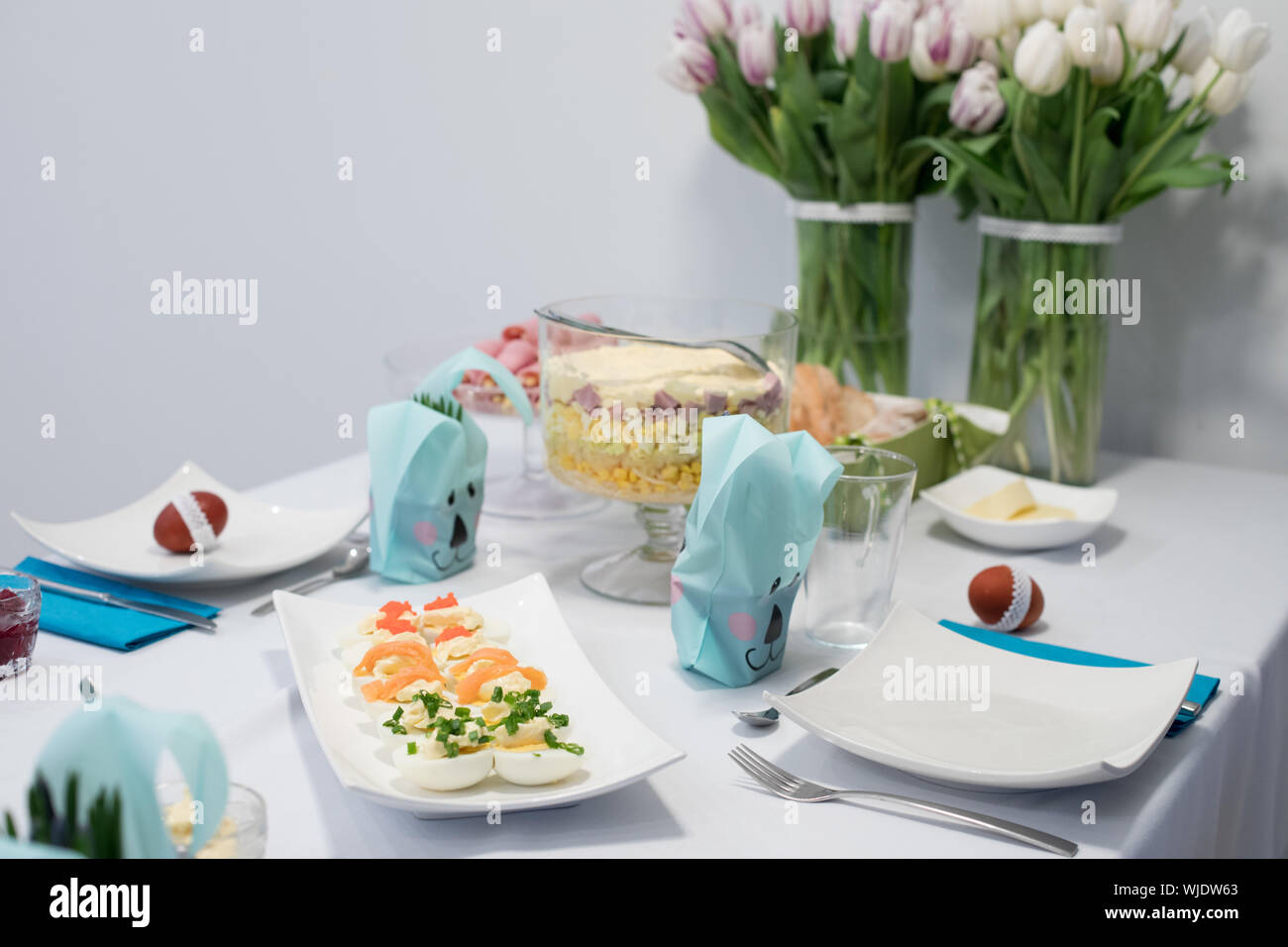 Traditional, polish Easter table with colored eggs, boiled eggs Stock Photo