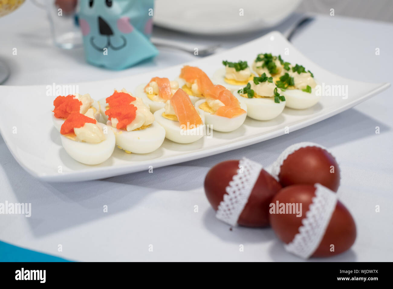 Traditional, polish Easter table with colored eggs, boiled eggs Stock Photo