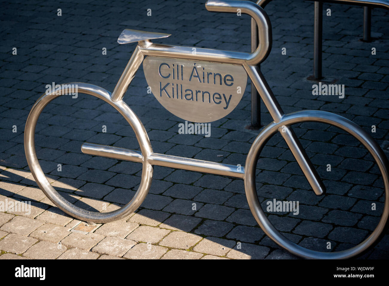 Innovative Killarney or Cill Airne iron chrome bicycle parking stand or bike racks in the shape of a bike as urban infrastructure environment detail. Stock Photo