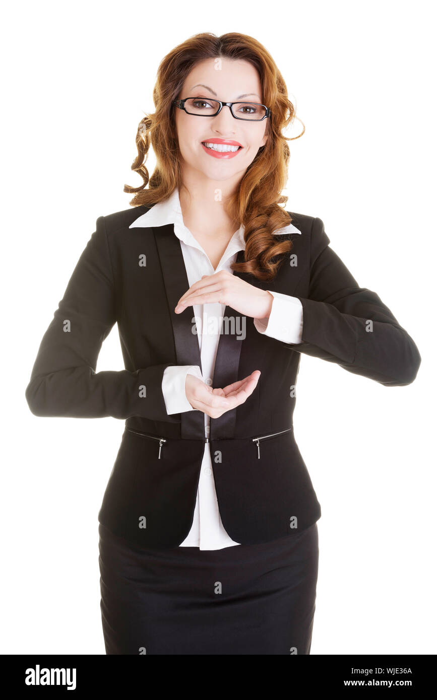 Happy business woman showing copy space on her palm, isolated on white ...