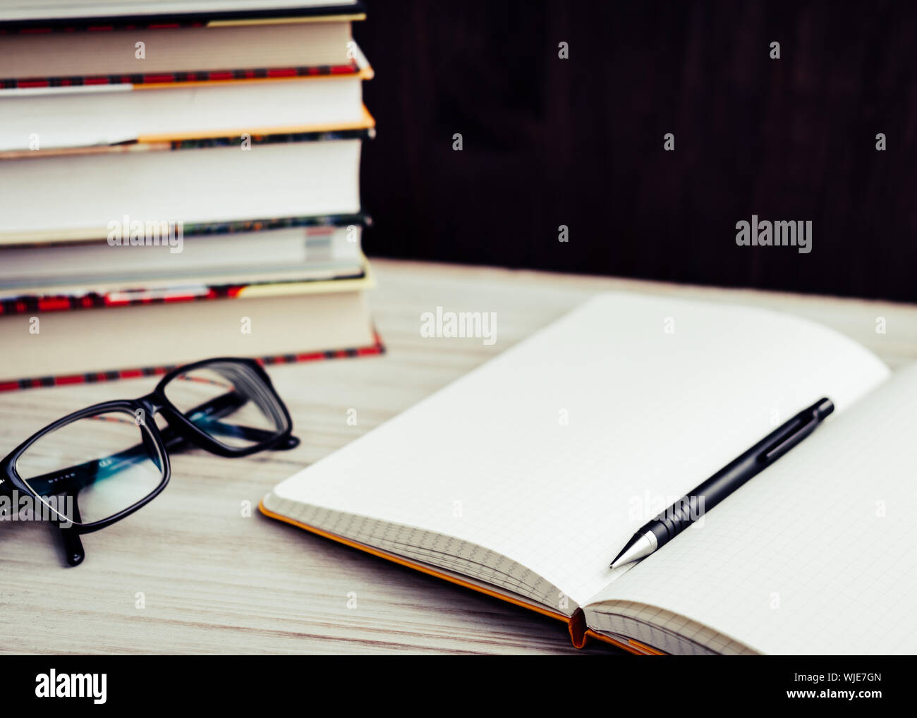 Open Book With Pen On Table Stock Photo - Alamy