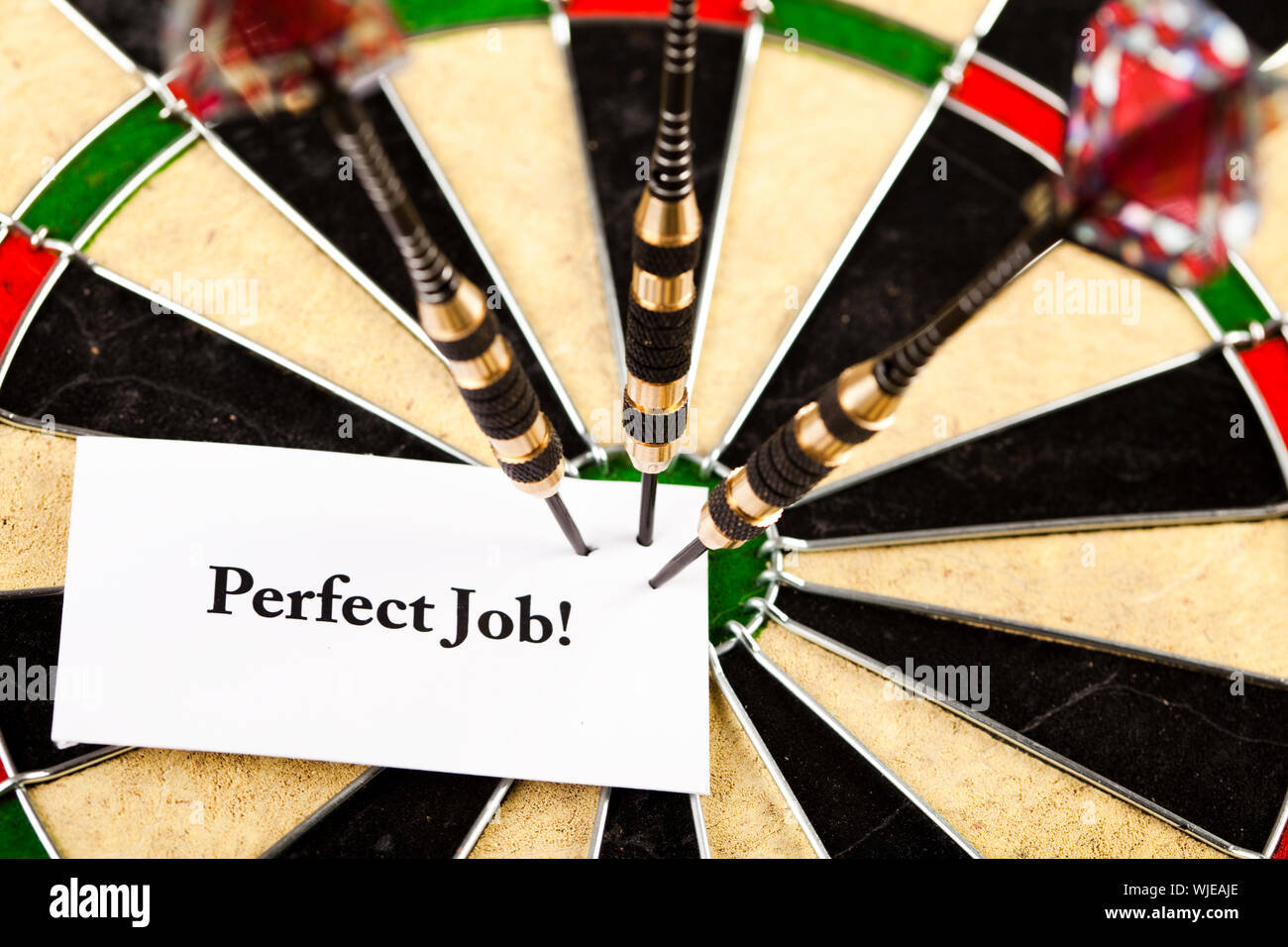 Darts in bull's-eye Stock Photo