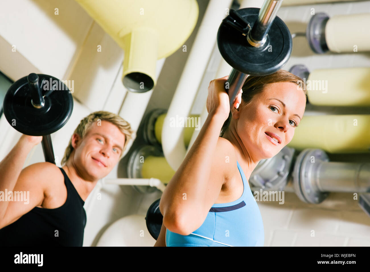 Power gymnastics with barbells Stock Photo - Alamy