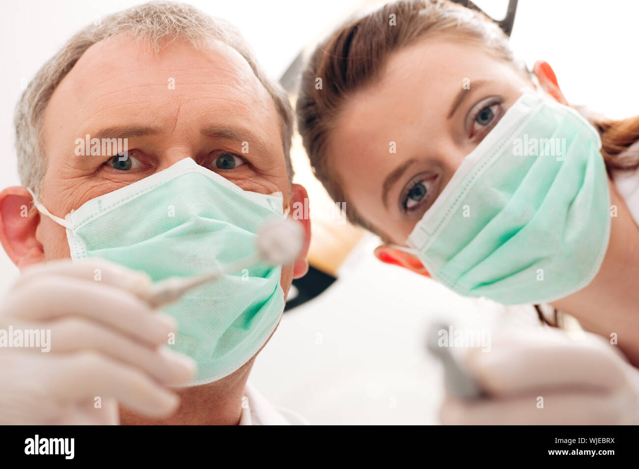 Dentist, Assistant and drill in a treatment Stock Photo Alamy