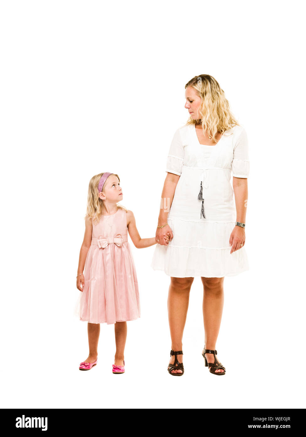 Mother and daughter holding hands isolated on white background Stock ...