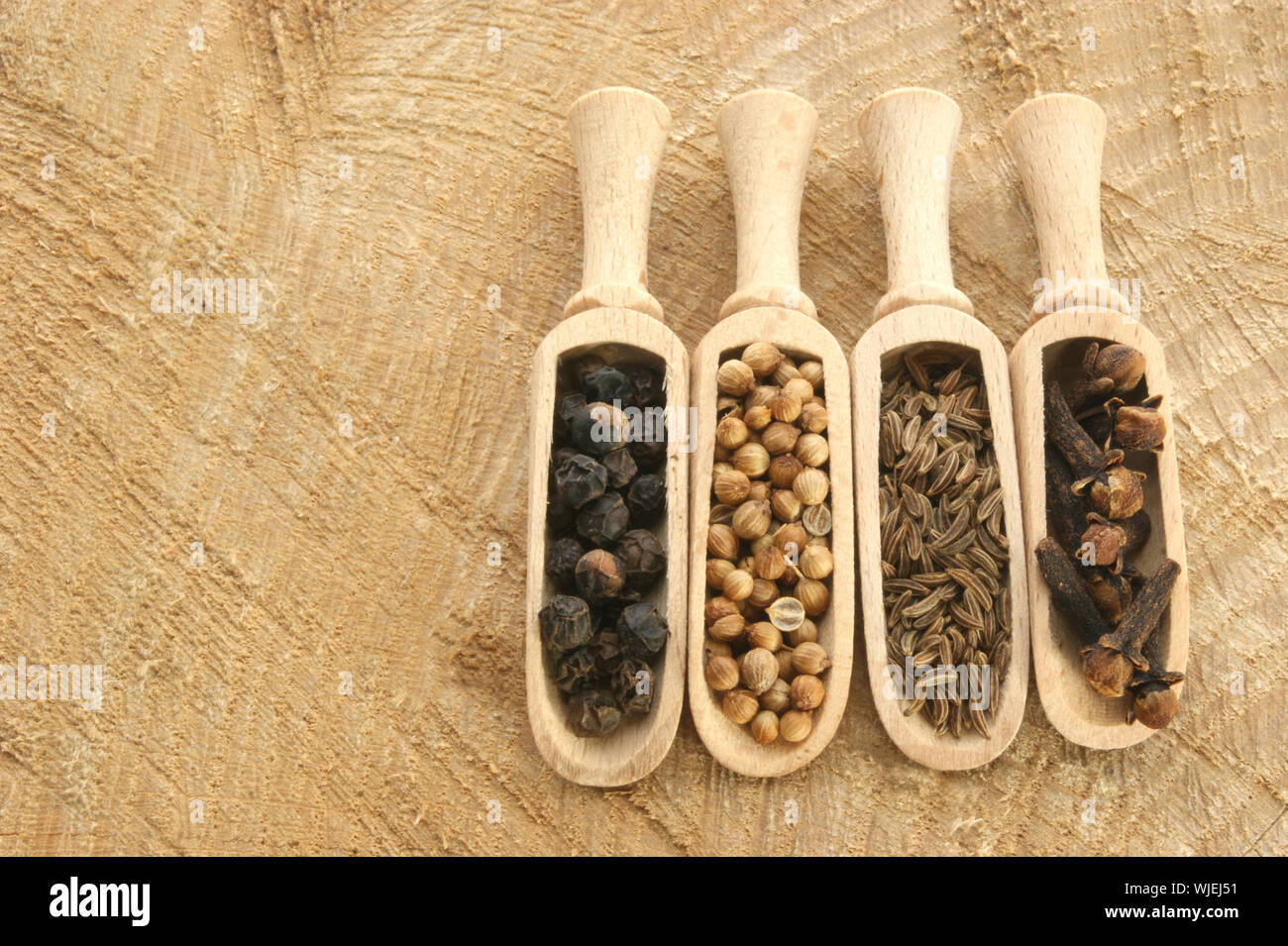four spices, pepper, coriander, cloves and caraway seed Stock Photo Alamy