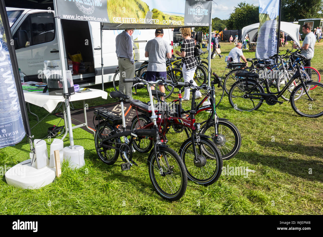 Forme and Benelli branded electric bikes on display on the Lancashire Show trade stand of 'I Cycle Electric', a specialist retailer of electric bikes. Stock Photo