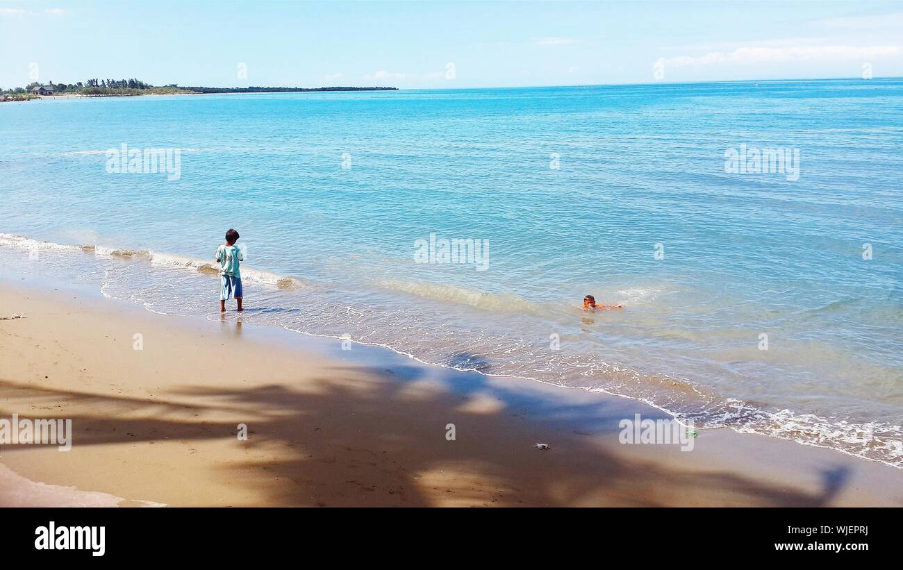 Two boys playing in the sand hi-res stock photography and images - Alamy