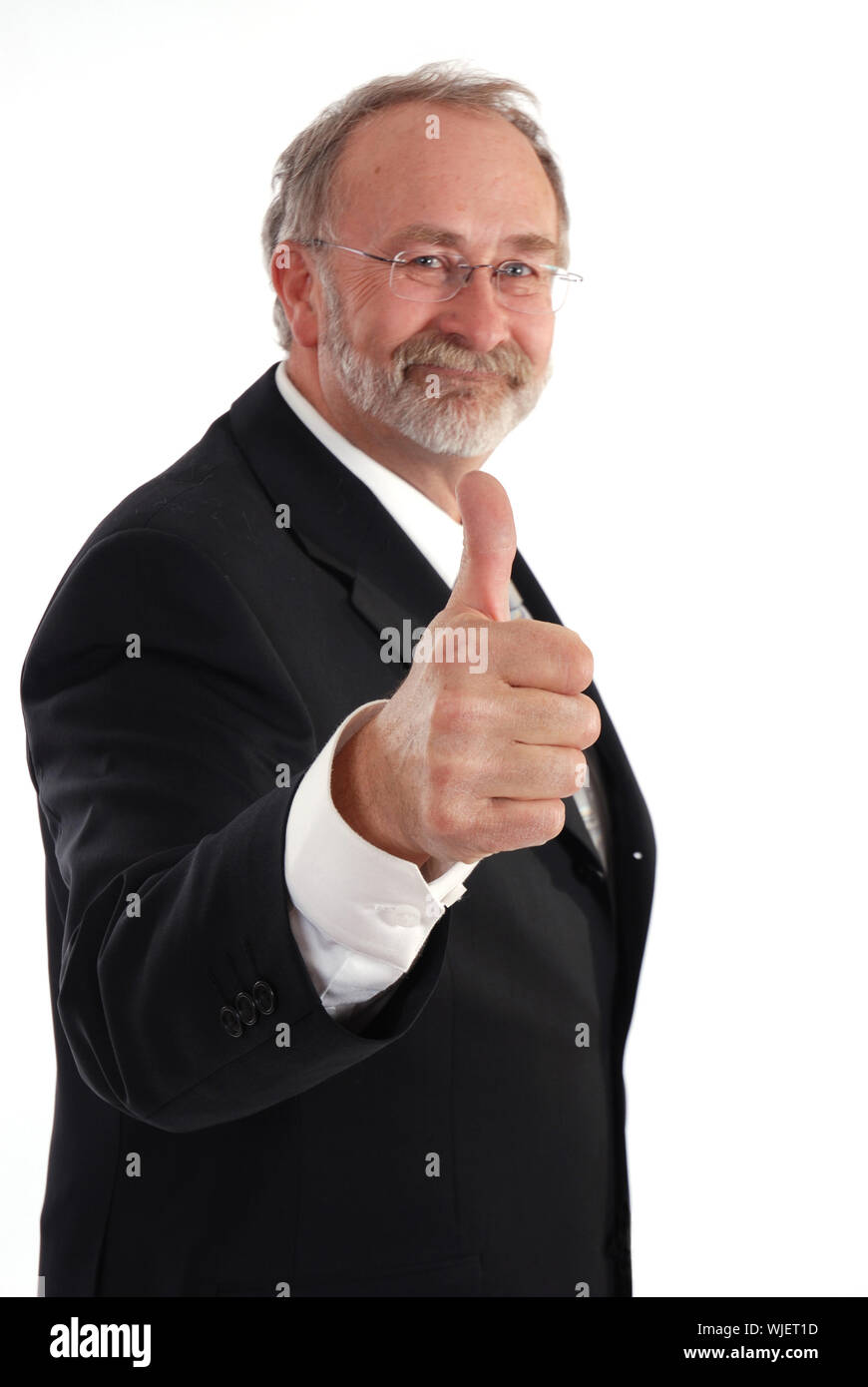 Senior businessman giving the thumbs up. Stock Photo