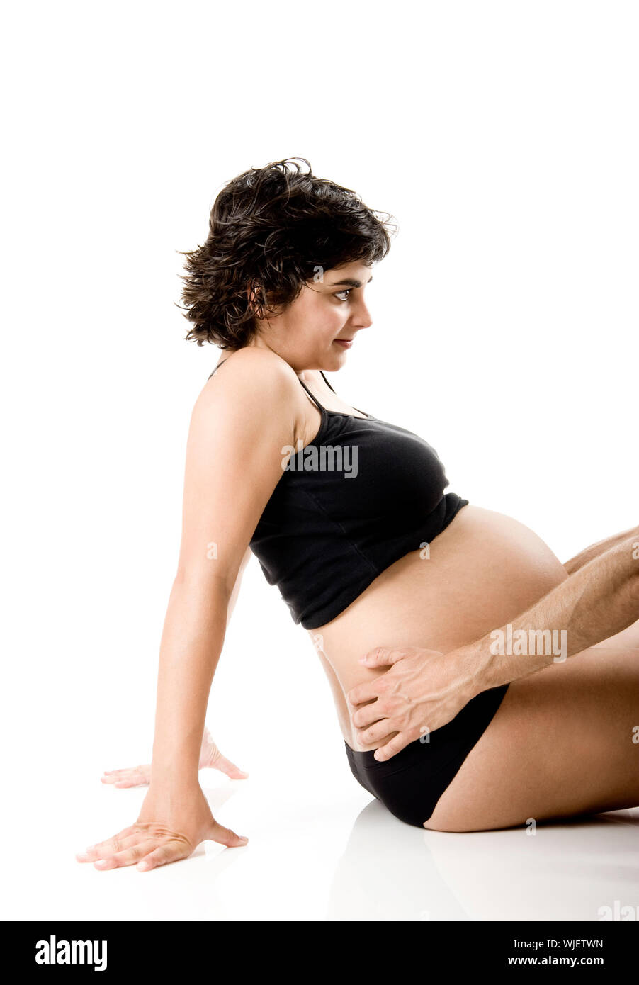 Nine Months pregnant woman isolated on white Stock Photo