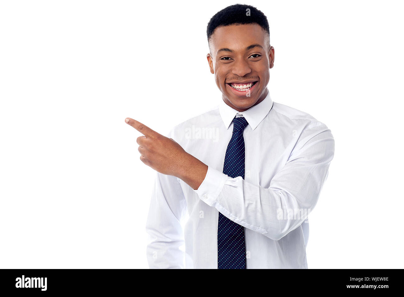 Handsome corporate male executive pointing away Stock Photo - Alamy
