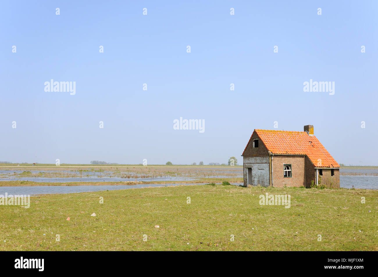 Water landscape in Holland with uninhabitable house Stock Photo - Alamy