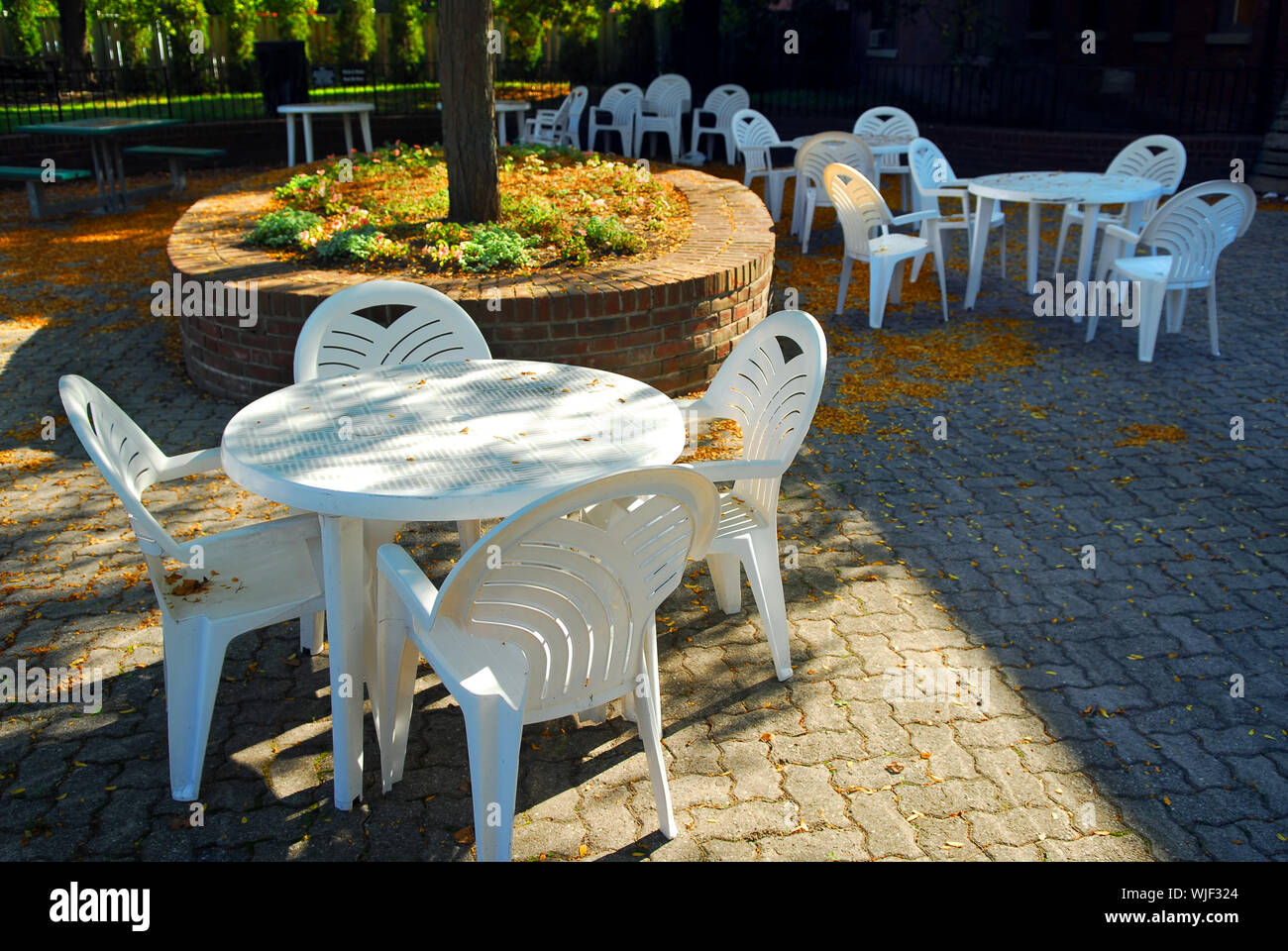 Empty tables of outdoor cafe in the fall Stock Photo
