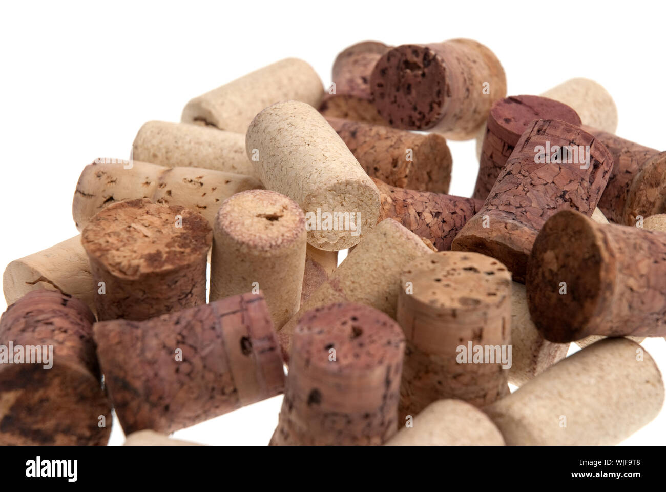 Used corks from bottles guilt isolated white background. Stock Photo