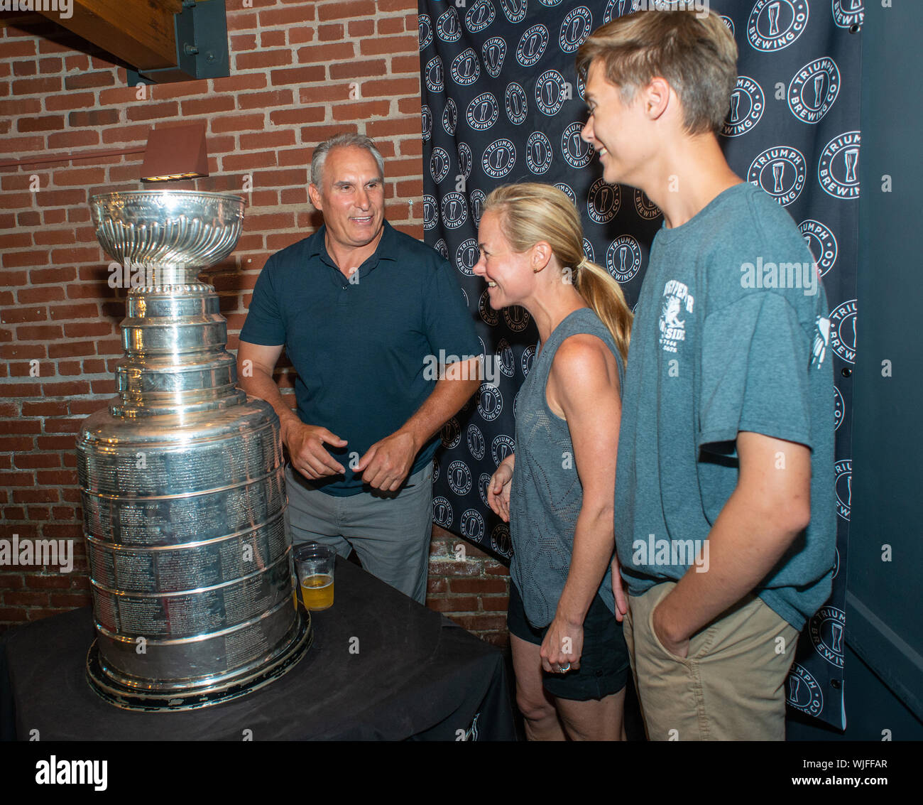https://c8.alamy.com/comp/WJFFAR/from-left-stanley-cup-champion-st-louis-blues-head-coach-craig-berube-poses-for-a-photo-with-laura-viehweger-and-ryan-viehweger-as-he-showed-off-the-WJFFAR.jpg