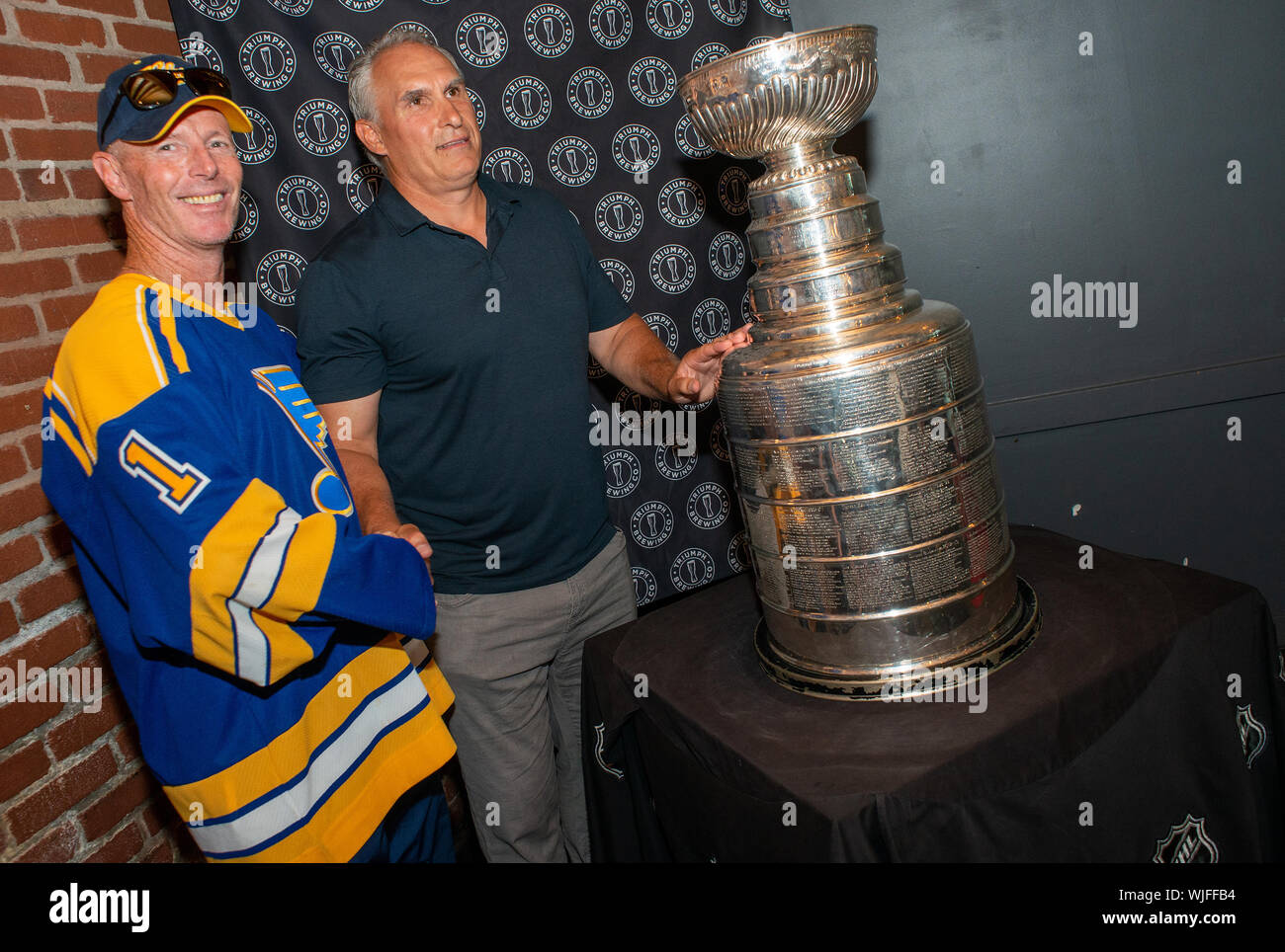 https://c8.alamy.com/comp/WJFFB4/donald-bourbon-left-of-shamong-new-jersey-poses-with-stanley-cup-champion-st-louis-blues-head-coach-craig-berube-as-he-showed-off-the-nhls-prized-WJFFB4.jpg