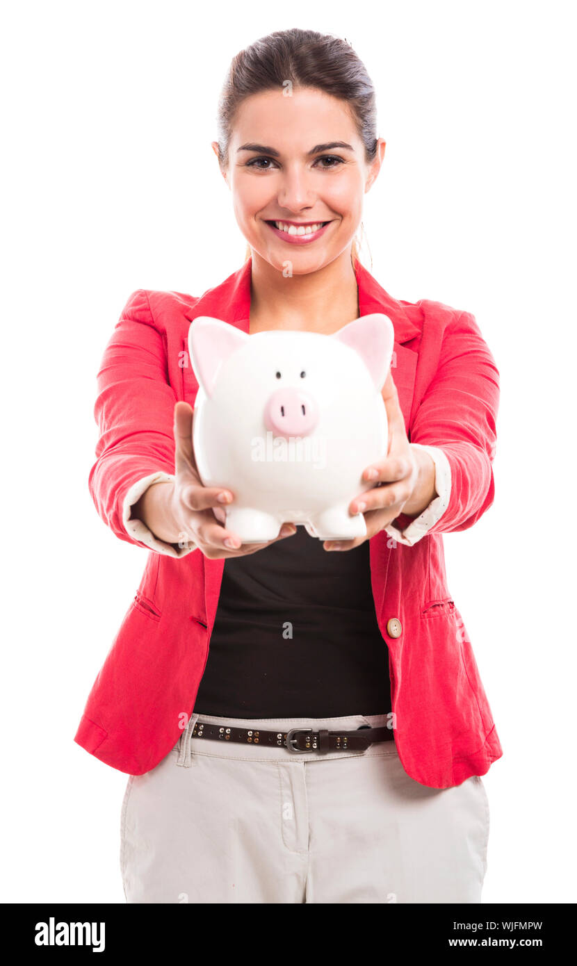 Business woman holding a piggy bank on the hands, isolated over a white ...