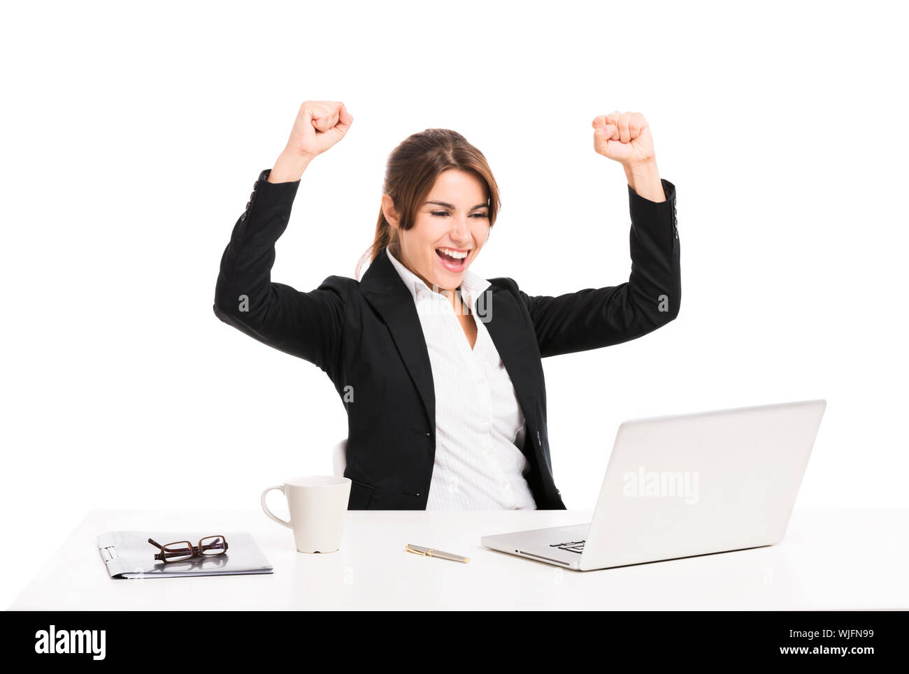 Happy and beautiful hispanic business woman in the office with arms up ...