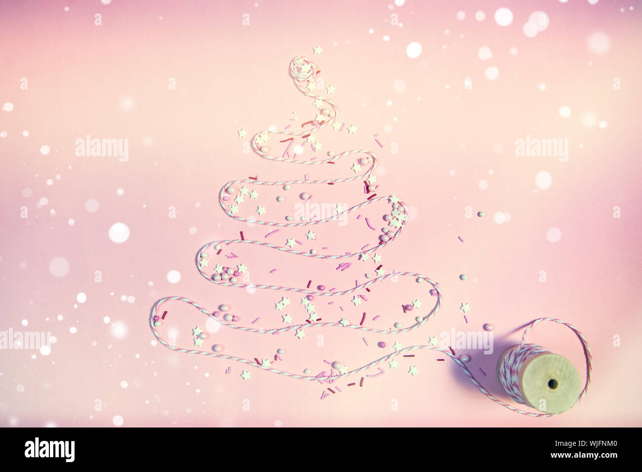 Christmas tree made with ribbon on pastel background. Copy space for ...
