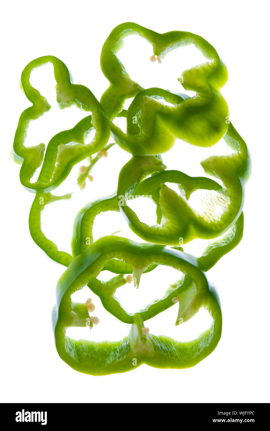 Sliced green pepper isolated on white background Stock Photo - Alamy