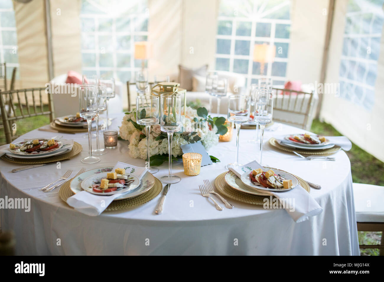 Elegant table set up for dinner in tent Stock Photo Alamy