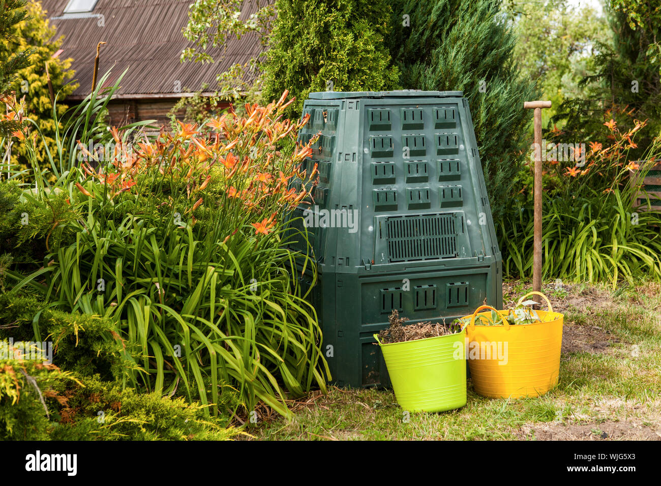 Compost bin in summer garden Stock Photo Alamy