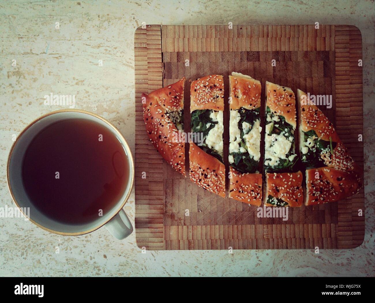 Directly Above Shot Of Black Tea And Pide Served On Table Stock Photo