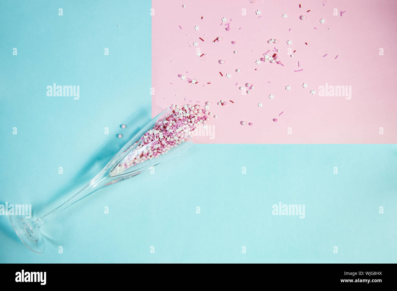 Colorful candy sprinkles in a champagne glass Stock Photo