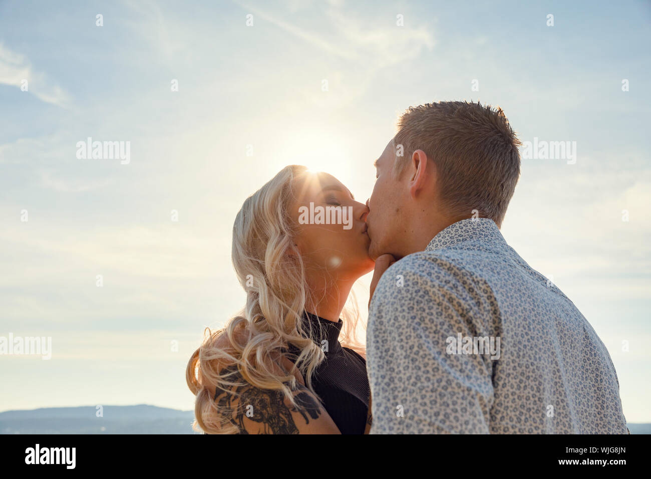 Couple sun kissing hi-res stock photography and images - Alamy