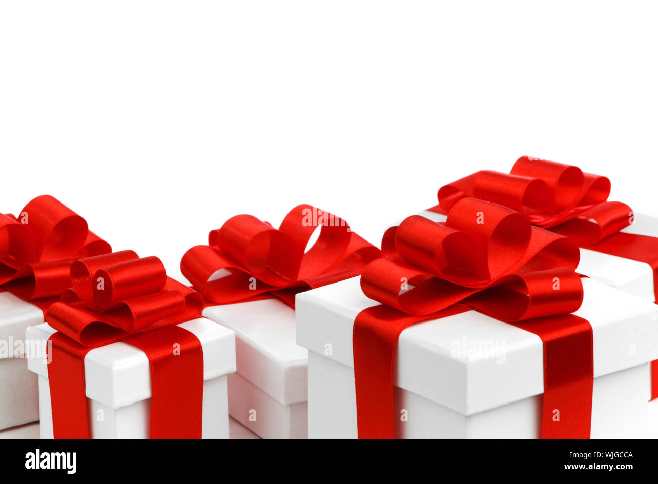 Gift boxes with red bow isolated on white background Stock Photo - Alamy
