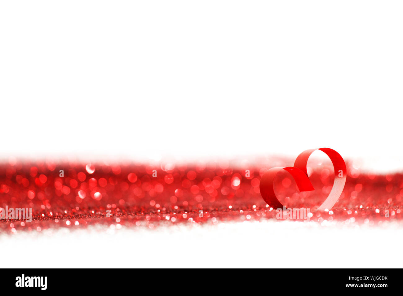 Valentines day decorative heart on red glitter background Stock Photo ...