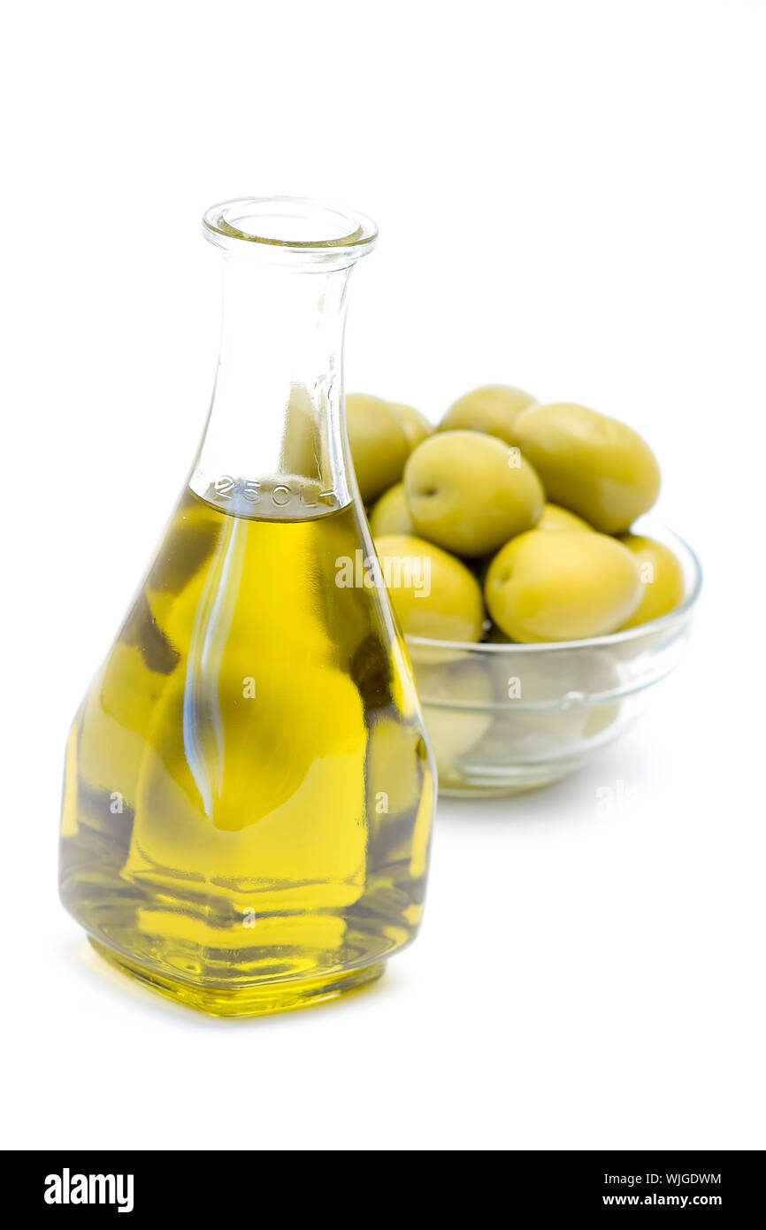 a bottle of olive oil with olives Stock Photo Alamy