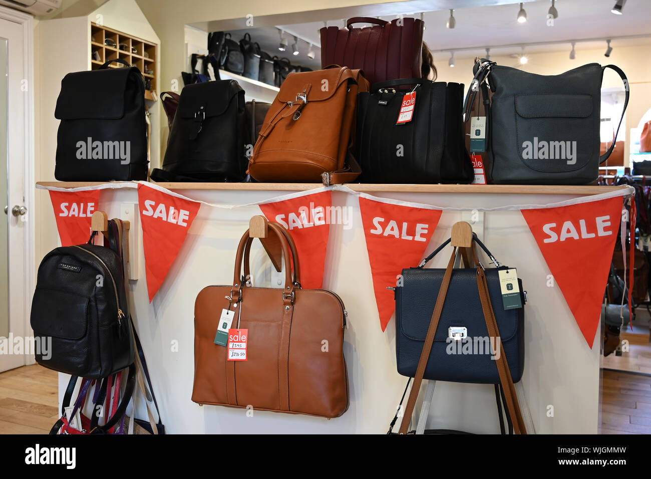 Ladies designer handbags sale Stock Photo - Alamy