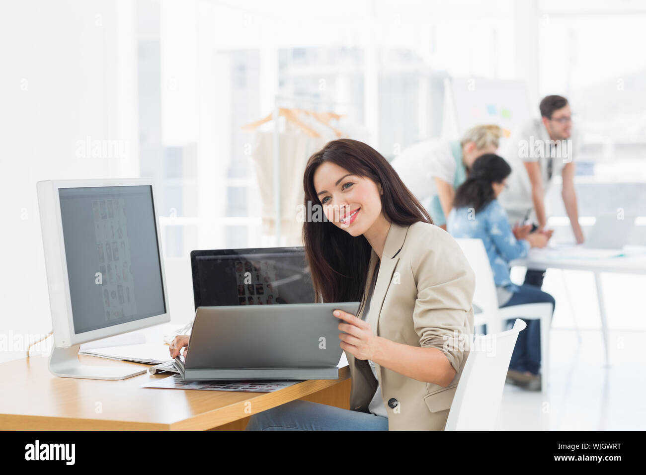 Black woman behind desk happy hi-res stock photography and images - Alamy