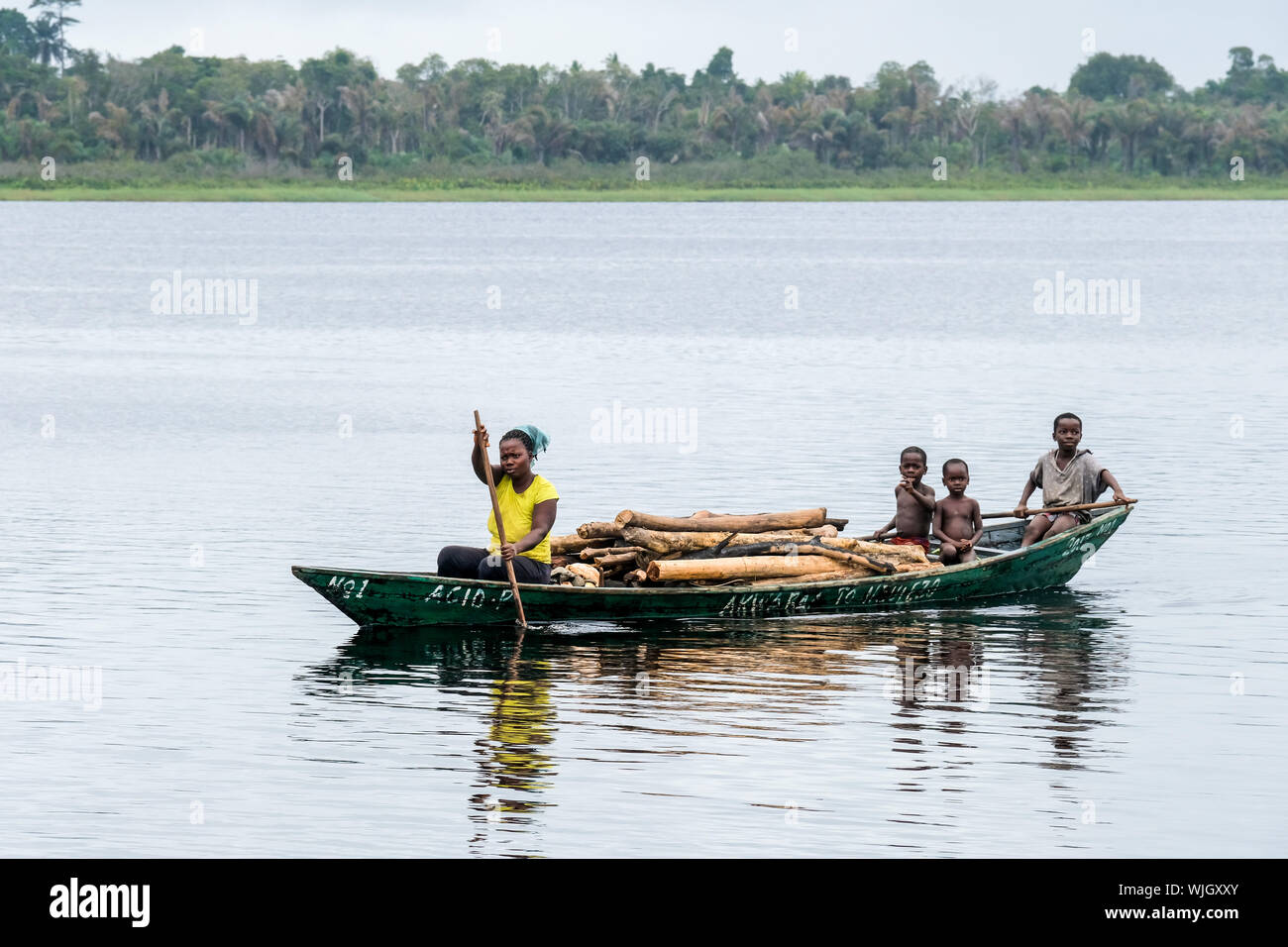 Dugout boat on Lake Amansuri near Nzulezo stilt village  / Ghana, Africa Stock Photo