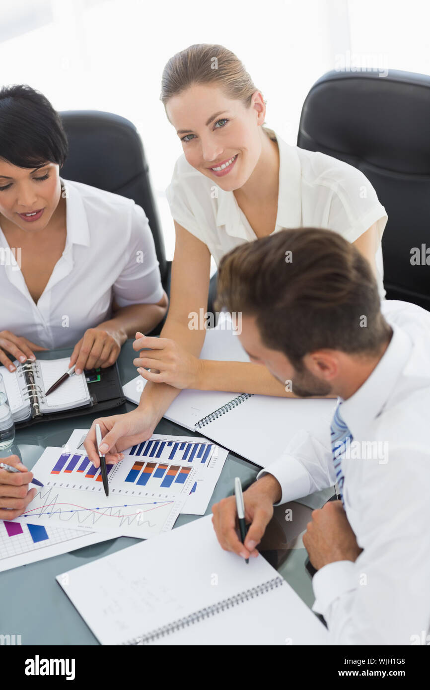 Young well dressed business people in discussion at a bright office Stock Photo Alamy