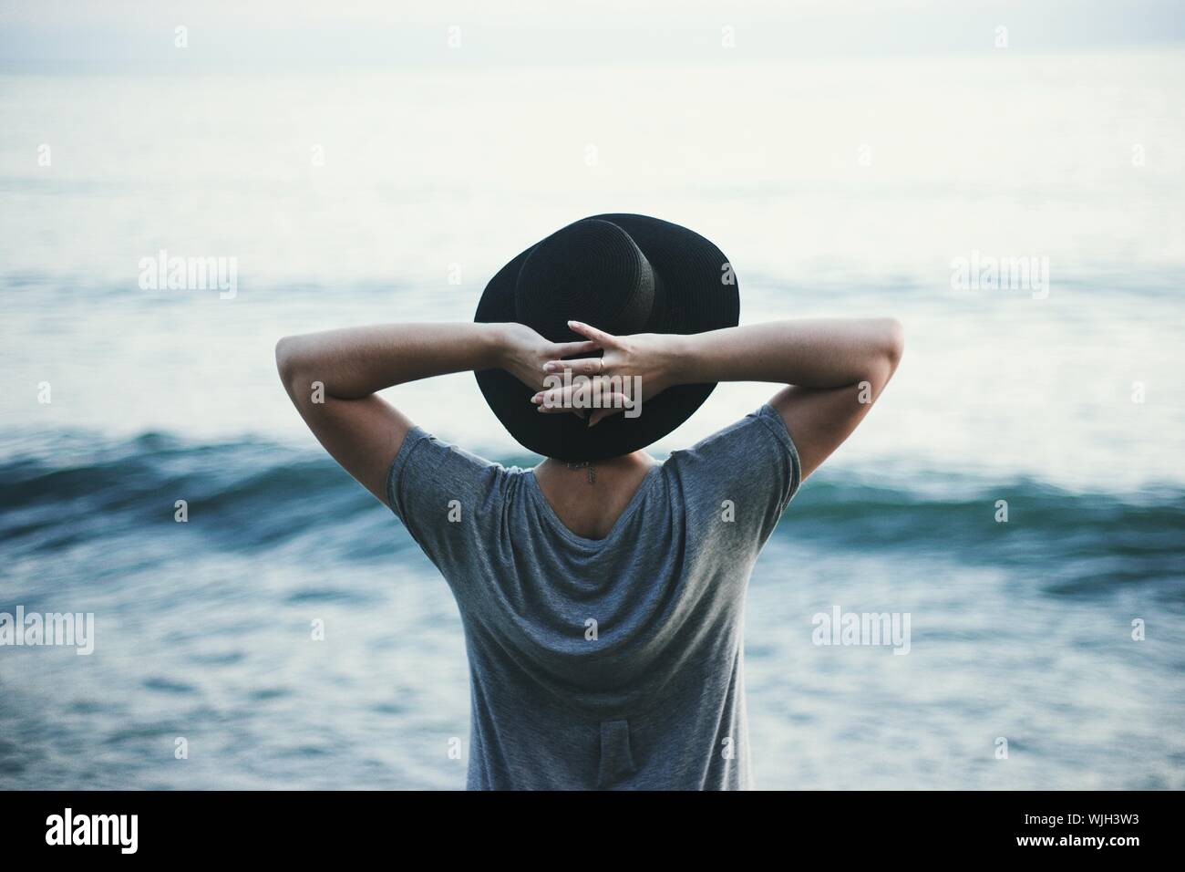 Woman head hands rear view hi-res stock photography and images - Alamy